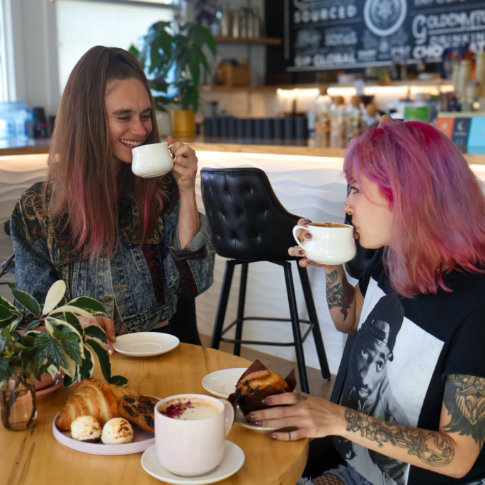 Inside Plant Bar, friends sharing coffee